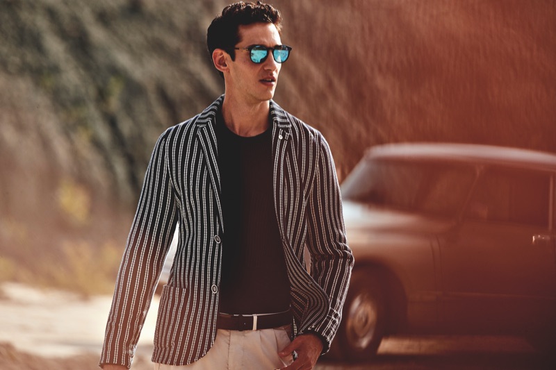 Wearing a striped blazer, Andrey Smidl appears in L.B.M. 1911's spring-summer 2019 campaign.