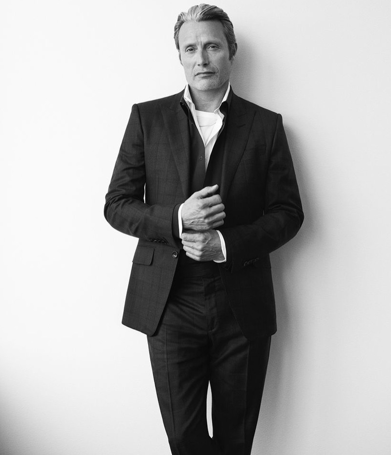 Front and center, Mads Mikkelsen wears a Tom Ford shirt, t-shirt, suit jacket and trousers with a Berluti shirt and Givenchy necklace. » Mads Mikkelsen Goes Minimal for Mr Porter, Talks 'Polar' Front and center, Mads Mikkelsen wears a Tom Ford shirt, t-shirt, suit jacket and trousers with a Berluti shirt and Givenchy necklace.