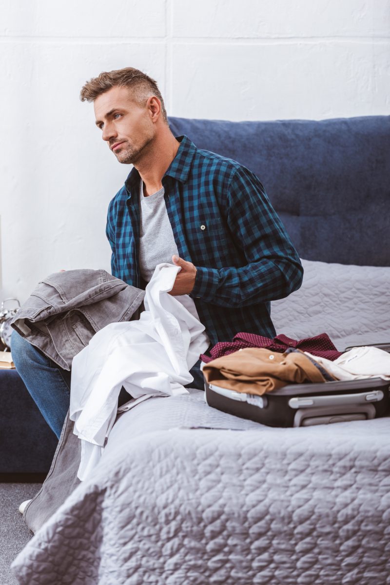 Man Organizing Clothes