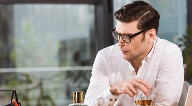 How to Focus On Your Mental Health Man with Whiskey Looking Depressed Wearing Glasses