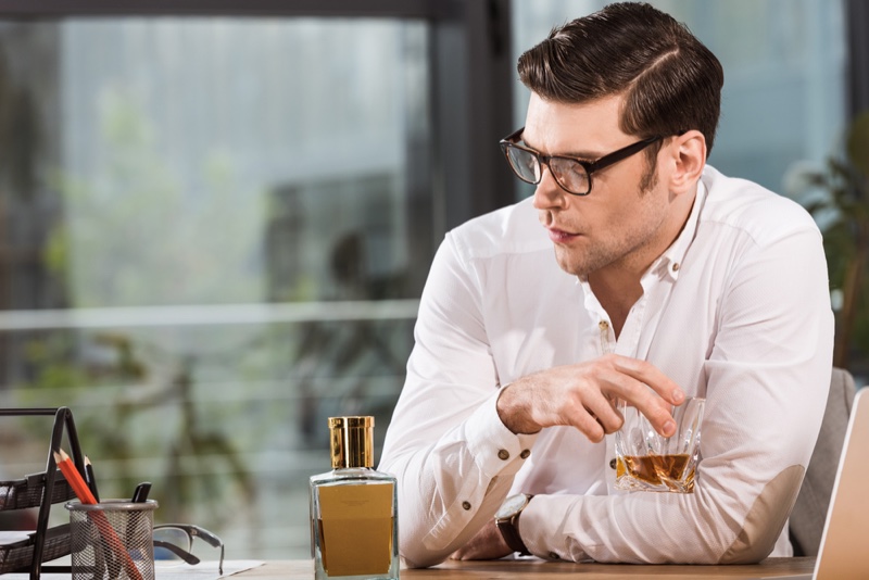 Man with Whiskey Looking Depressed Wearing Glasses