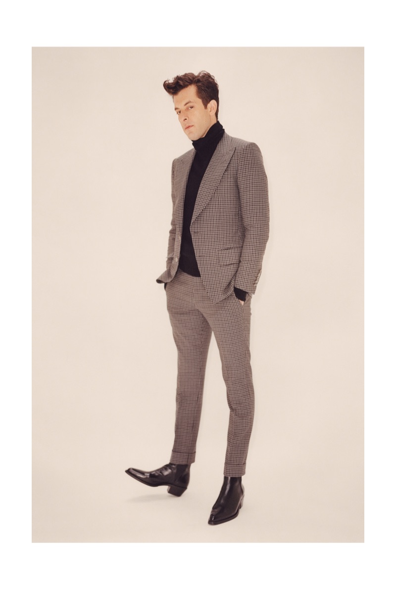 Front and center, Mark Ronson dons a slim tailored suit.