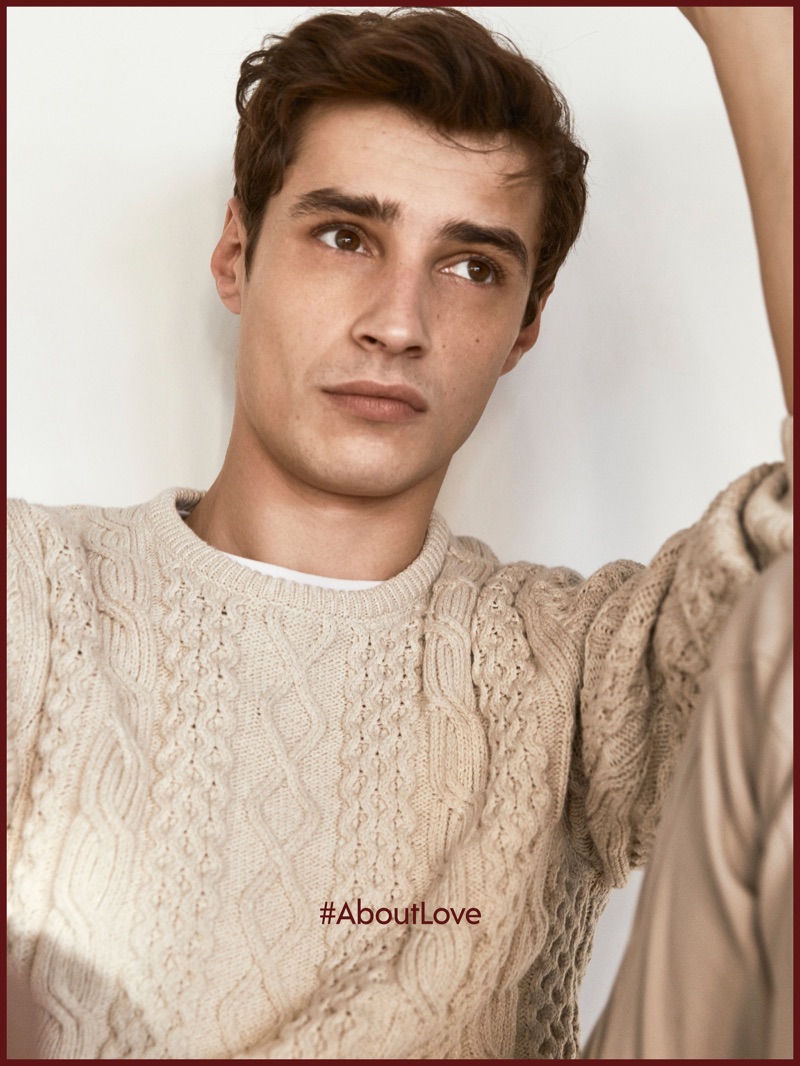 Adrien Sahores dons a cable-knit sweater by Massimo Dutti.