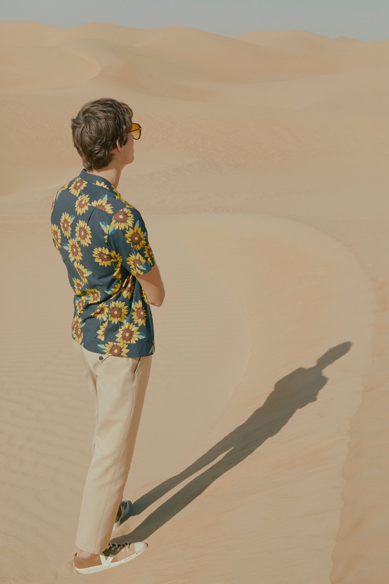 Florals: Felix Gesnouin sports a Mr P. t-shirt with Burberry chinos, Brioni sunglasses, and Veja sneakers.