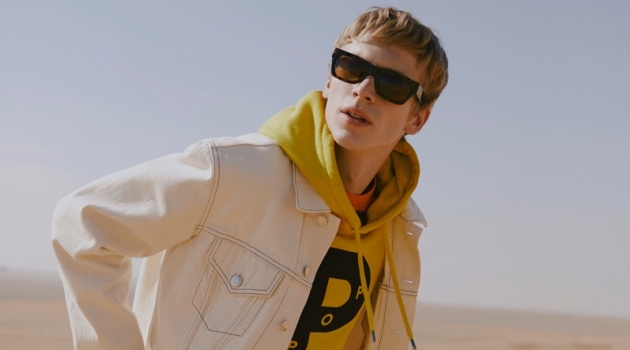 Mr Porter Curates Spring '19 Fashions Trends Fluoro: Robbie Gruendler rocks a Helmut Lang denim trucker jacket, Albam striped t-shirt, and a Pop Trading Company fluoro logo hoodie.