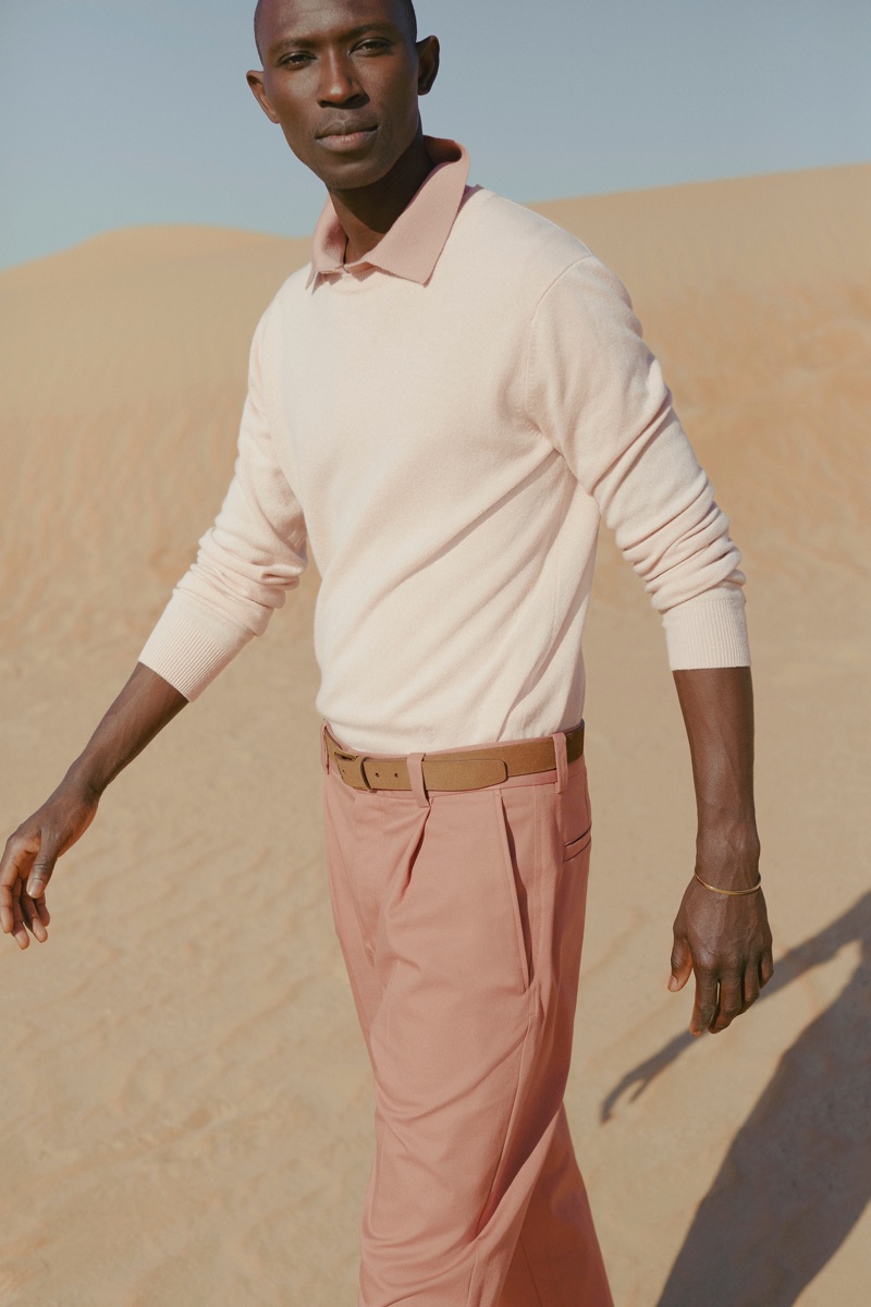 Pastels: Armando Cabral dons a pink cashmere sweater by Stella McCartney with Acne Studios trousers.