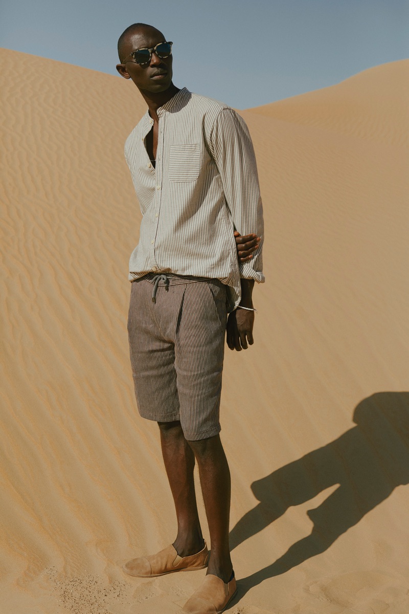 Pleats: Armando Cabral wears an Oliver Spencer grandad-collar striped shirt with Berluti + Oliver Peoples sunglasses.