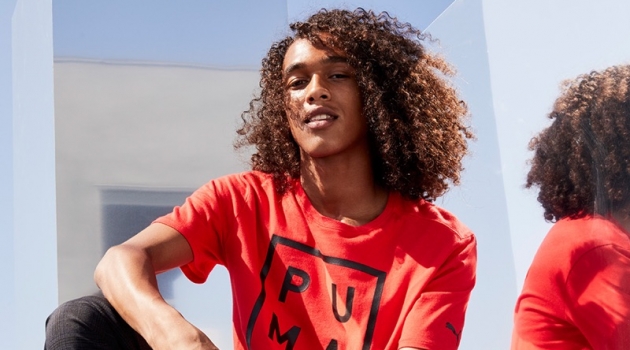 Rocking a red PUMA t-shirt, Leo Hoye-Egan connects with Nordstrom for a sporty outing.
