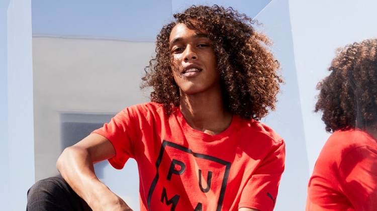 Rocking a red PUMA t-shirt, Leo Hoye-Egan connects with Nordstrom for a sporty outing.