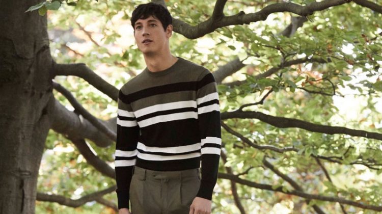 Argentinean model Nicolas Ripoll sports a striped sweater and trousers by Pedro del Hierro.