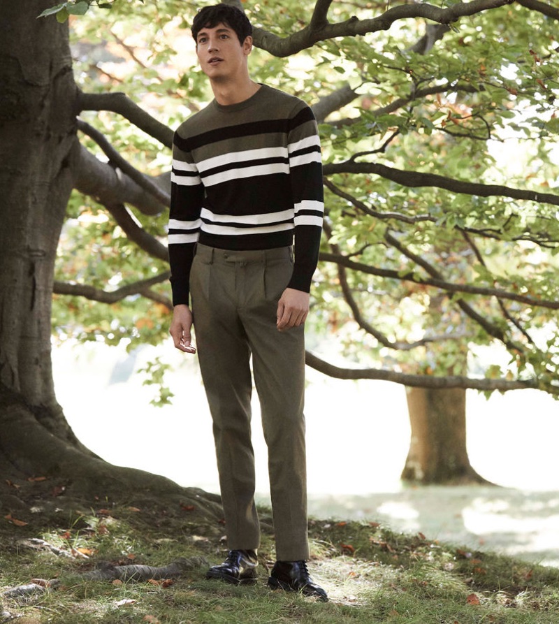 Argentinean model Nicolas Ripoll sports a striped sweater and trousers by Pedro del Hierro.