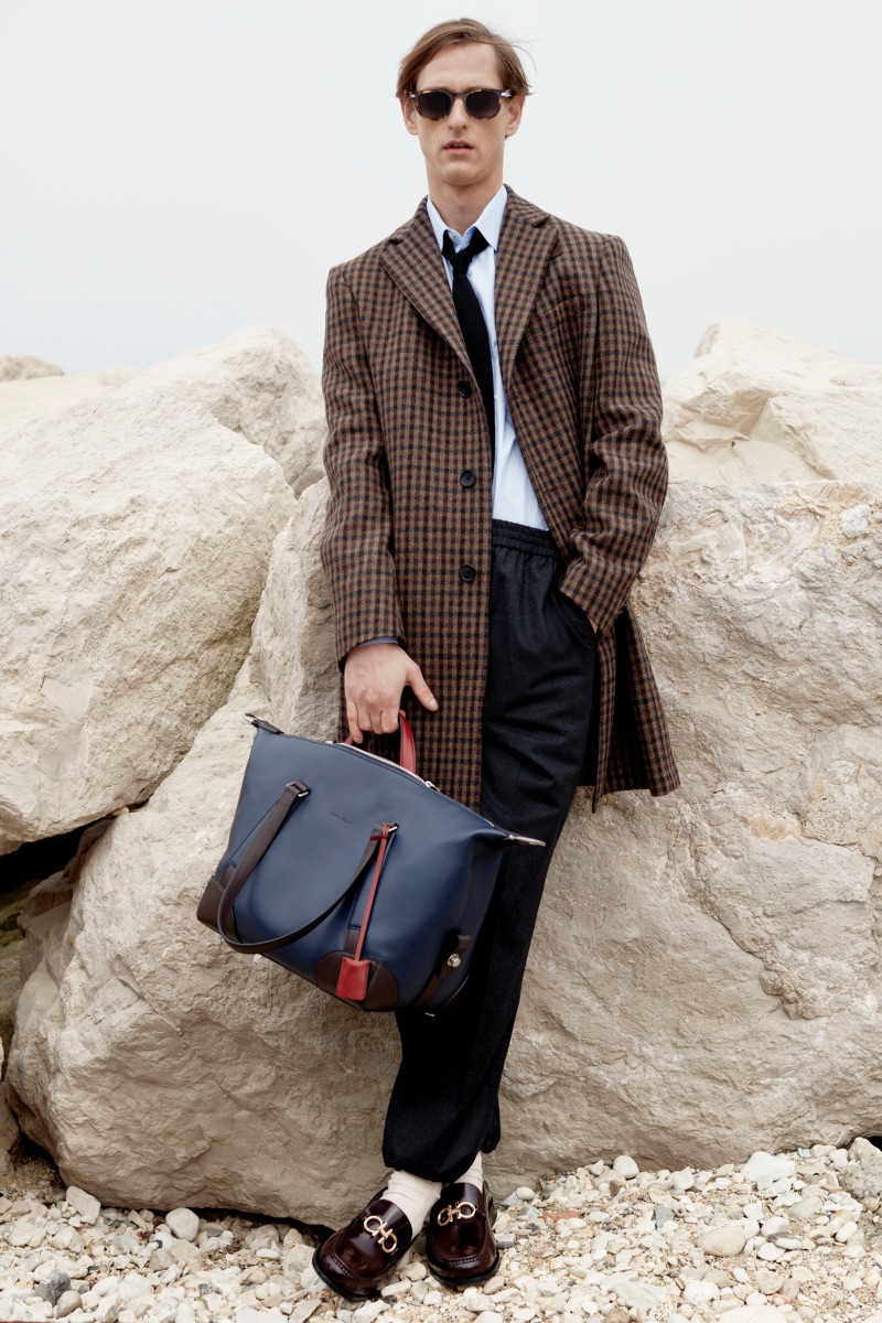 A chic vision, Rogier Bosschaart dons a checked coat from Salvatore Ferragamo.