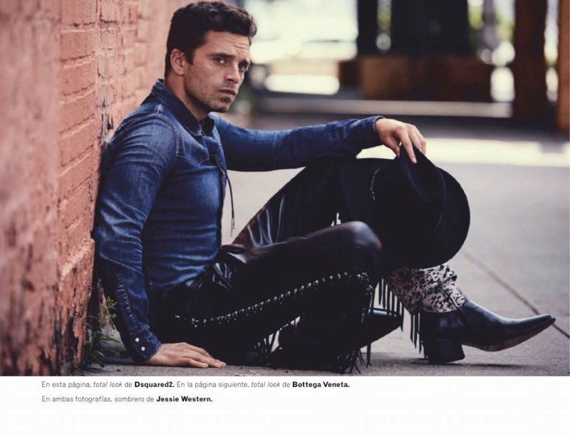 Starring in a photo shoot, Sebastian Stan sports a denim western shirt, leather pants, and boots by Dsquared2.