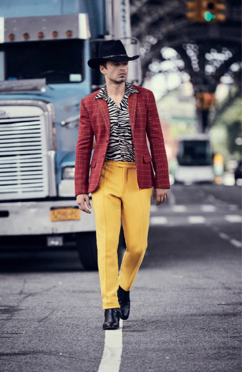 Heading out, Sebastian Stan wears a bold look from Bottega Veneta with a Jessie Western cowboy hat.