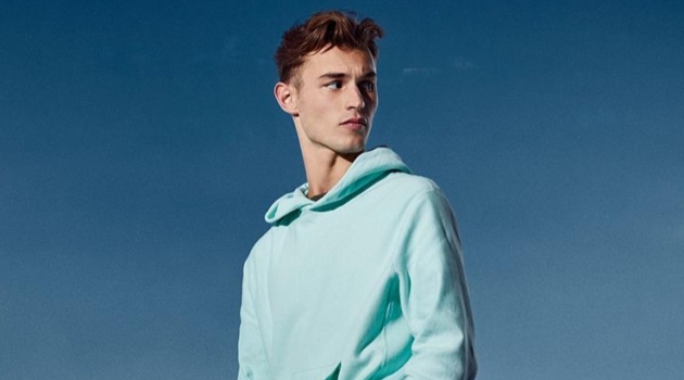 Kit Butler Embraces Bright Colors in Todd Snyder + Champion Looks Stepping out, Kit Butler wears a Todd Snyder + Champion terry pullover hoodie and jogger sweatpants.