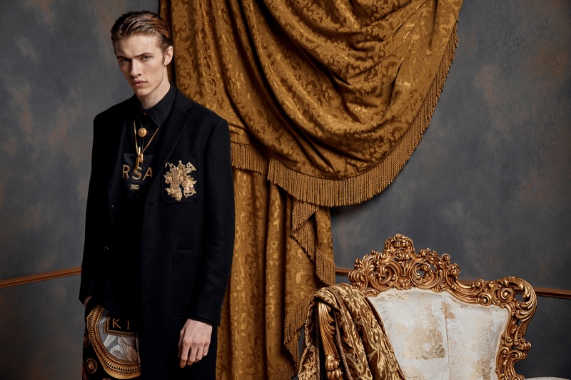 Embracing a tailored look, Lucky Blue Smith dons pieces from the Kith x Versace collection.