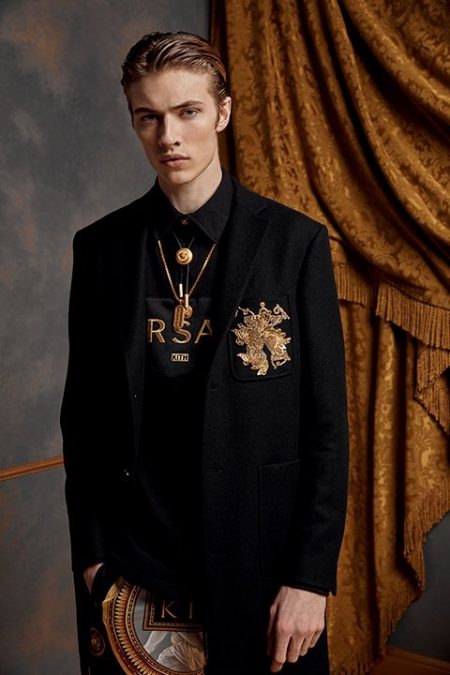 Embracing a tailored look, Lucky Blue Smith dons pieces from the Kith x Versace collection.