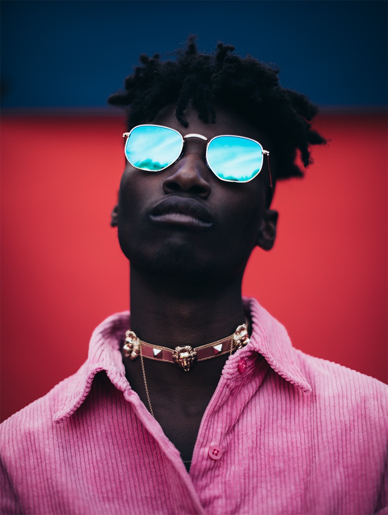 Xuly wears shirt ASOS, necklace stylist's own, and sunglasses Tevin Vincent.