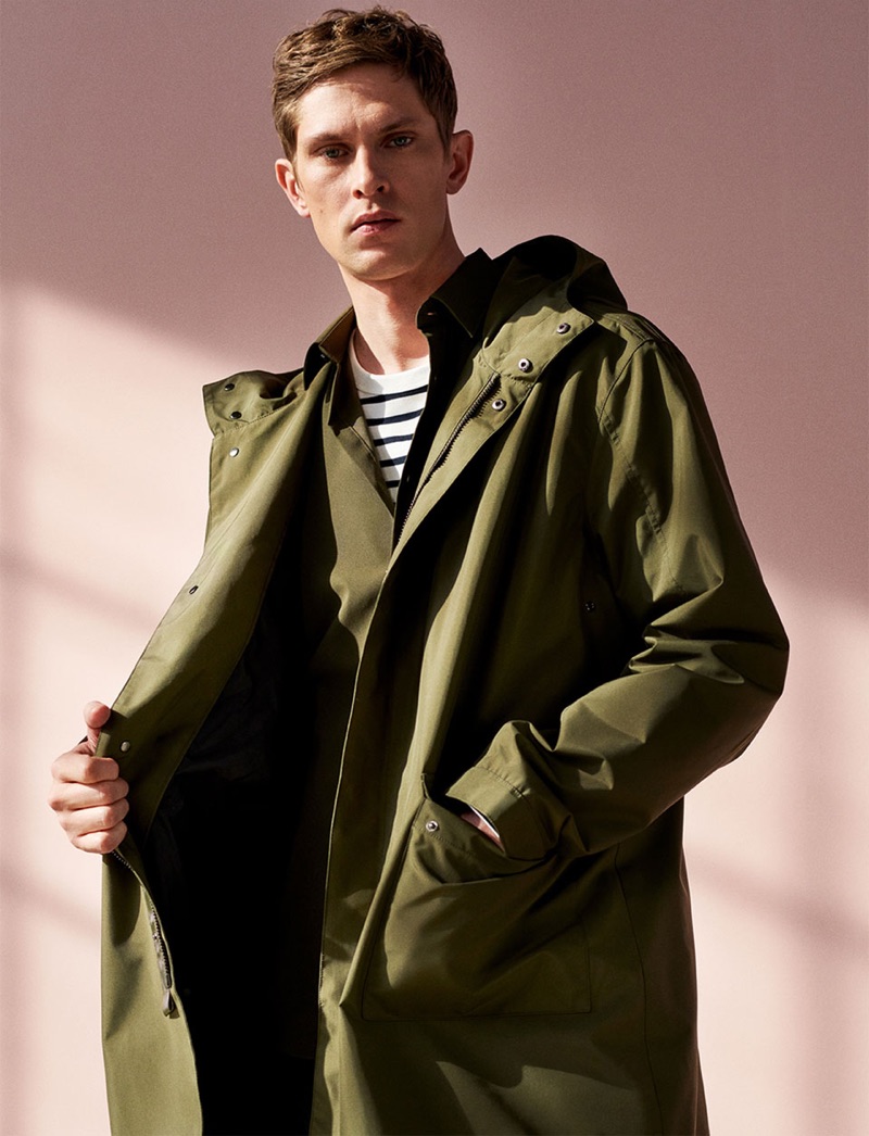 Model Mathias Lauridsen sports a parka with a striped pullover by Zara.