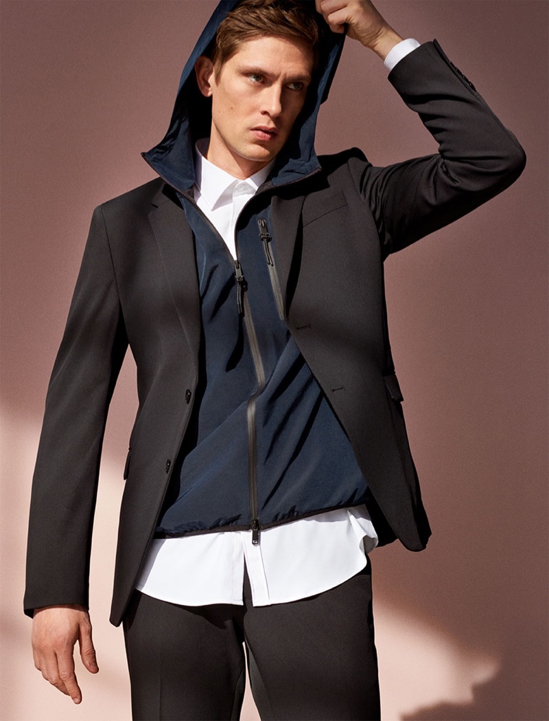 Going sporty, Mathias Lauridsen dons a hooded jacket with a suit.