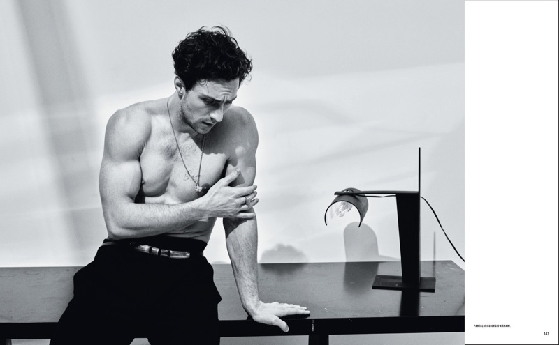 Posing shirtless, Aaron Taylor-Johnson dons Giorgio Armani trousers.