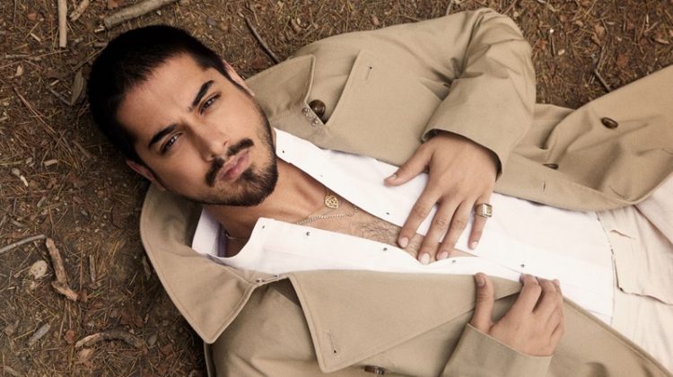 Starring in a new photo shoot, Avan Jogia sports a H&M trench with a SCYLT shirt, COS trousers, and a ring by Topman.