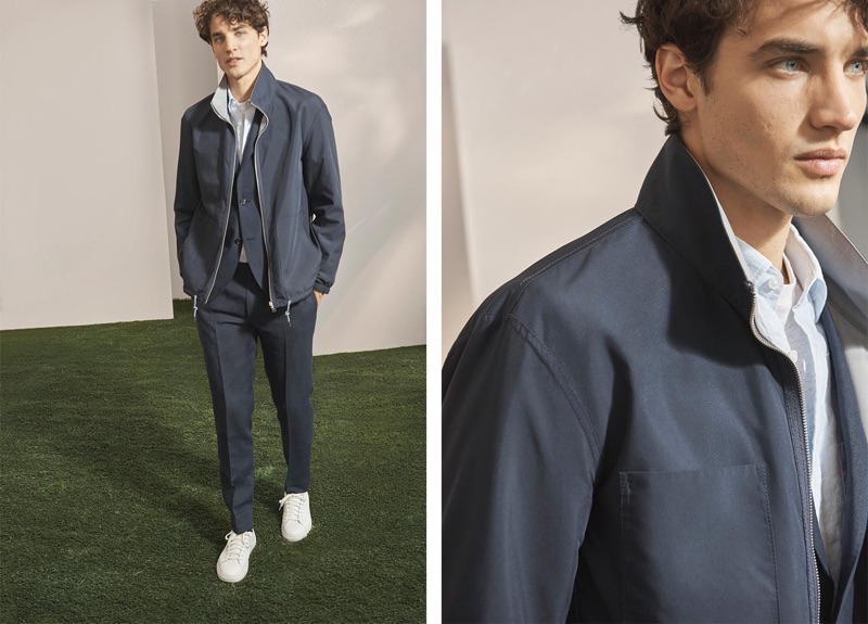 Embracing monochromatic style, Federico Novello wears a Club Monaco linen blazer, reversible track jacket, bandana shirt, linen trousers, and sneakers.