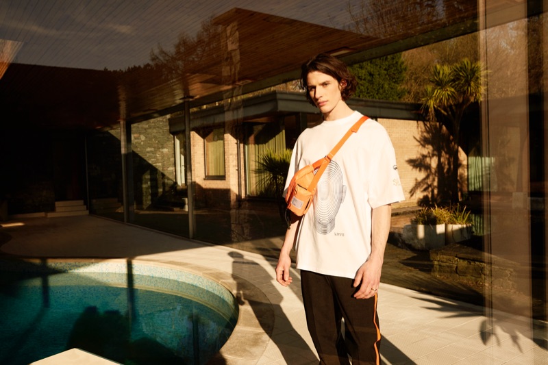 Starring in Coggles' spring-summer 2019 campaign, Liam Gardner wears a Lanvin t-shirt with Helmut Lang pants and a Satisfy belt bag.