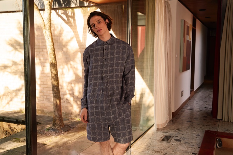 Model Liam Gardner rocks a J.W. Anderson shirt and shorts for Coggles' spring-summer 2019 campaign.