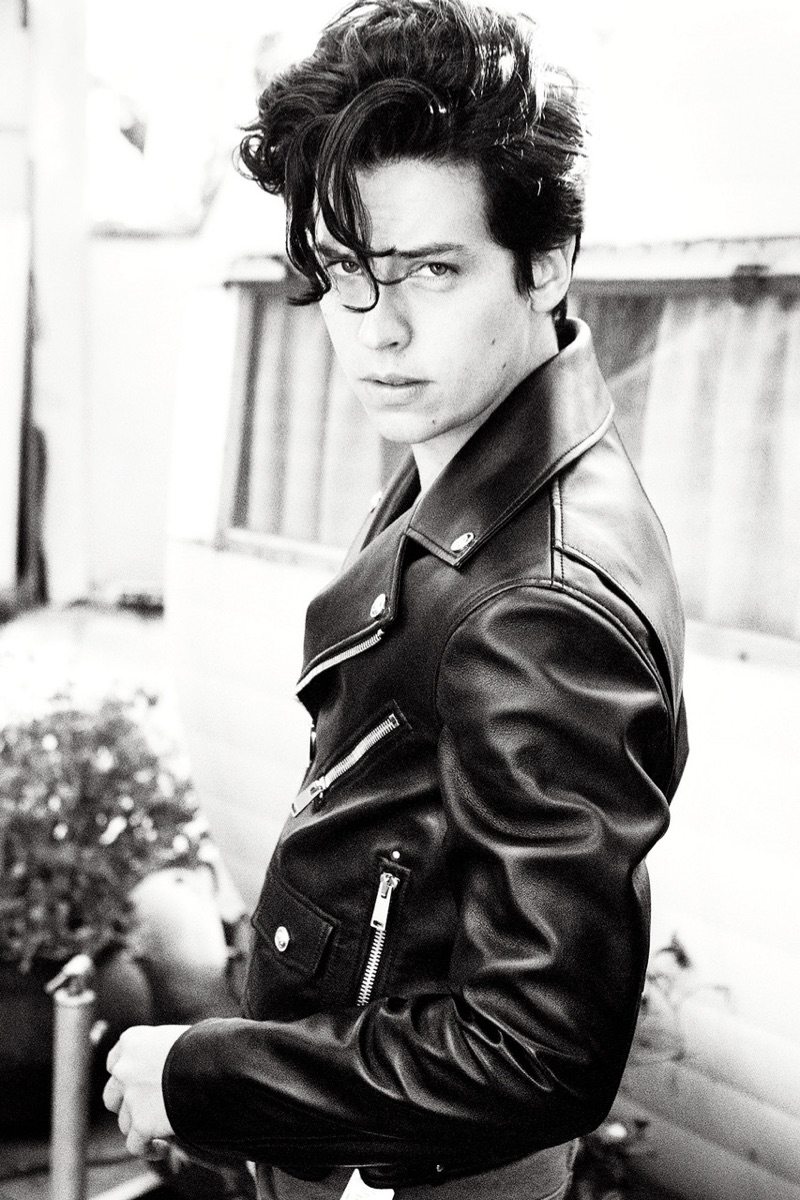 Channeling the 1950s, Cole Sprouse wears a Versace leather biker jacket with Balmain jeans.