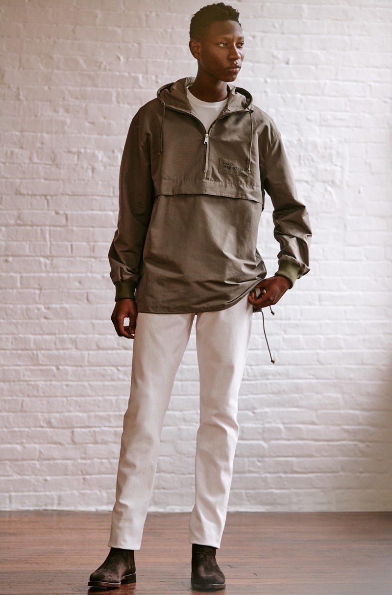 Front and center, Lang Jobe rocks a Halo anorak, Helmut Lang jeans, Stüssy tee, and Allen Edmonds suede Chelsea boots.