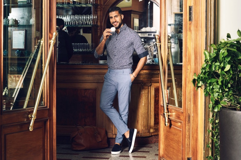 A smart vision, Emre Can dons a H&M premium cotton shirt, skinny-fit suit pants, and suede slip-on shoes.