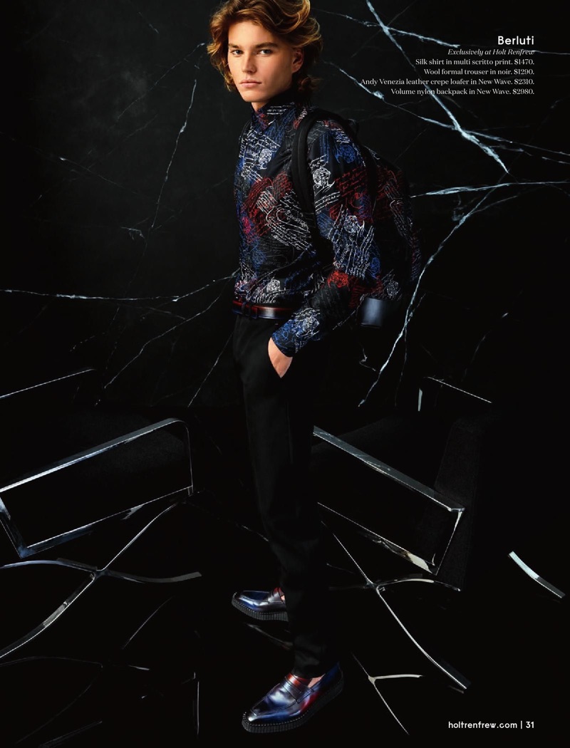 Embracing a graphic print, Jordan Barrett wears a silk shirt, trousers, backpack, and loafers from Berluti.