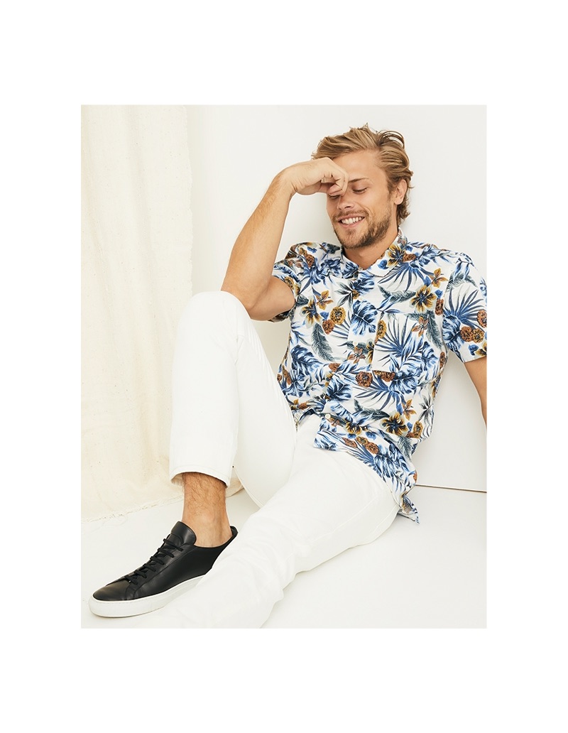 All smiles, Christopher Mason rocks a Lucky Brand floral print shirt and 110 skinny white pants.