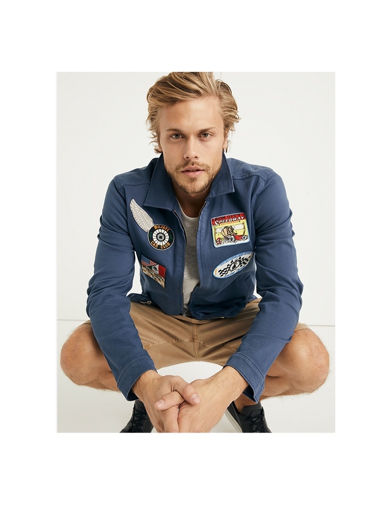 Christopher Mason wears a zip front racer jacket and linen one pocket tee from Lucky Brand.