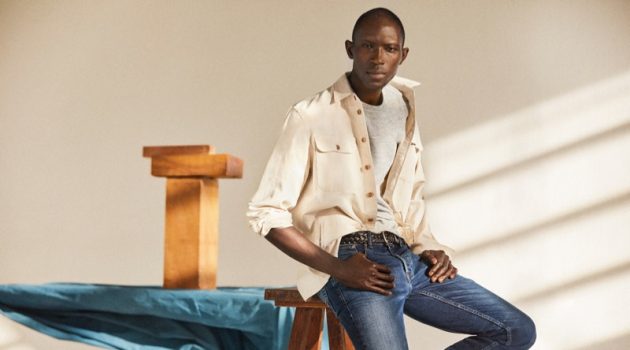 Armando Cabral Rocks Denim for Mango Spring '19 Style Guide Medium Denim: A chic vision, Armando Cabral wears distressed denim jeans with an off-white oversized shirt.