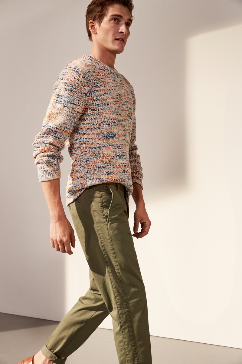 Embracing spring fashions, Matvey Lykov wears Marc O'Polo's marle sweater and slim-fit pants.