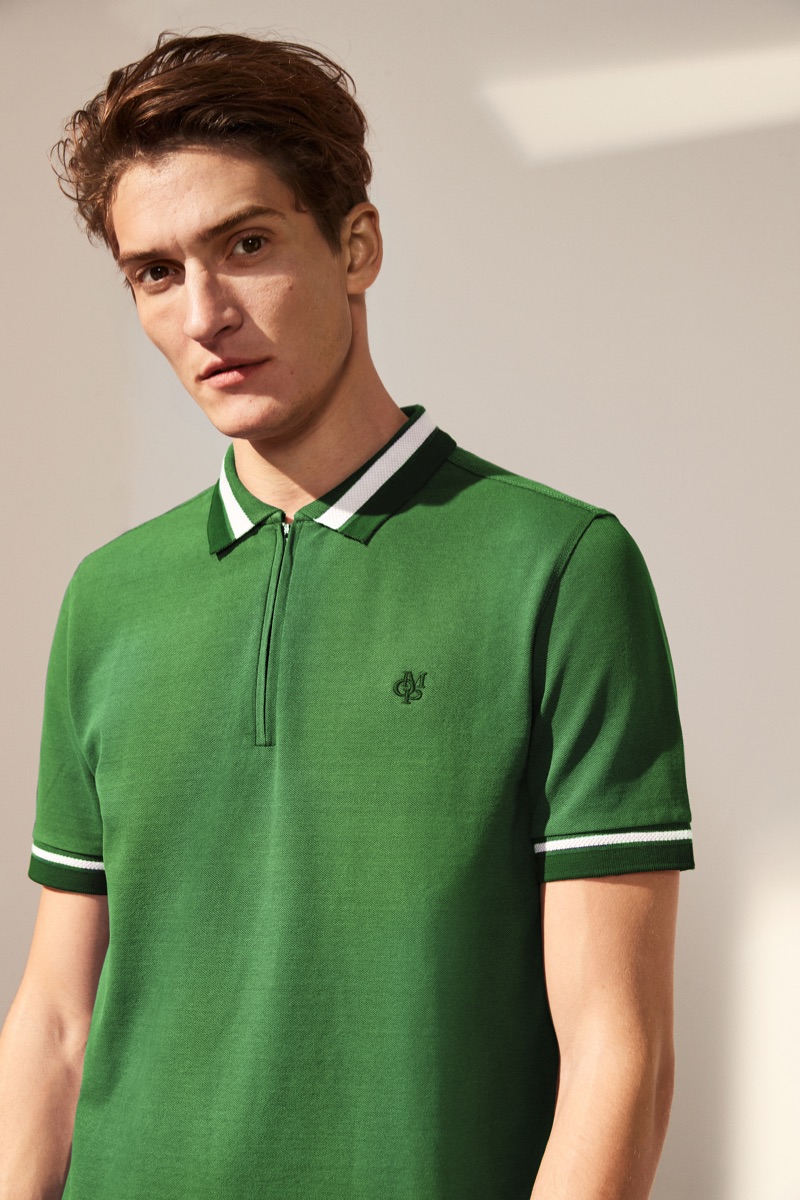 Connecting with Marc O'Polo for spring, Matvey dons a green zippered polo.