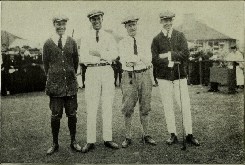1920s men pose for a photo at a game of golf. The men wear the current golf attire trends of the time with white pants, cardigan sweaters, knickerbockers, and flat caps.