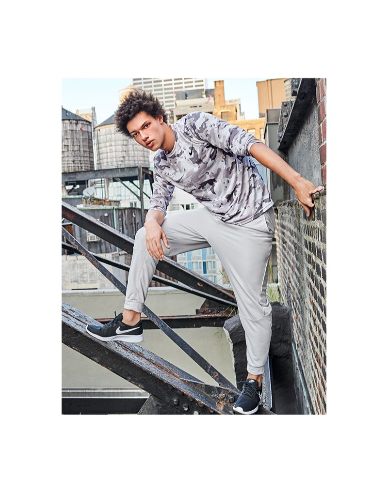 Model Gabriel Gomieri dons a Nike dry camo-print training shirt with joggers.
