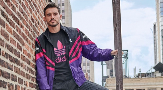 Fashion #Fitspo: Arthur Kulkov & Gabriel Gomieri Sport Activewear for Macy's Channeling retro style, Arthur Kulkov rocks an adidas Originals sportive colorblocked track jacket, trackpants, and treifoil logo t-shirt.