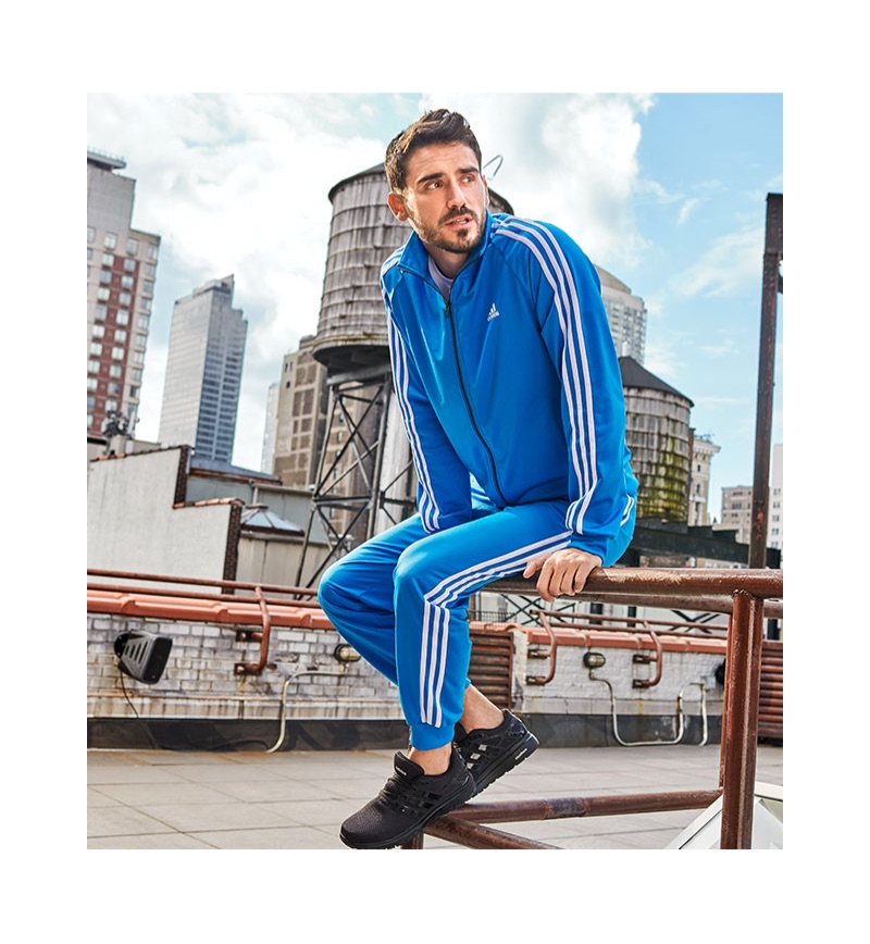 Reuniting with Macy's, Arthur Kulkov wears an adidas essentials tricot track jacket and pants.
