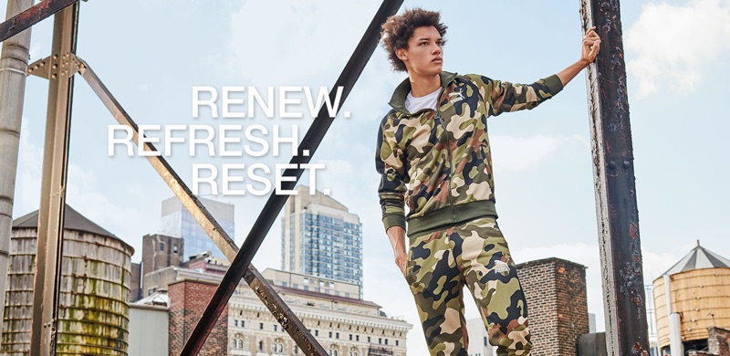 Gabriel Gomieri goes sporty in a camouflage print track jacket and pants by PUMA.