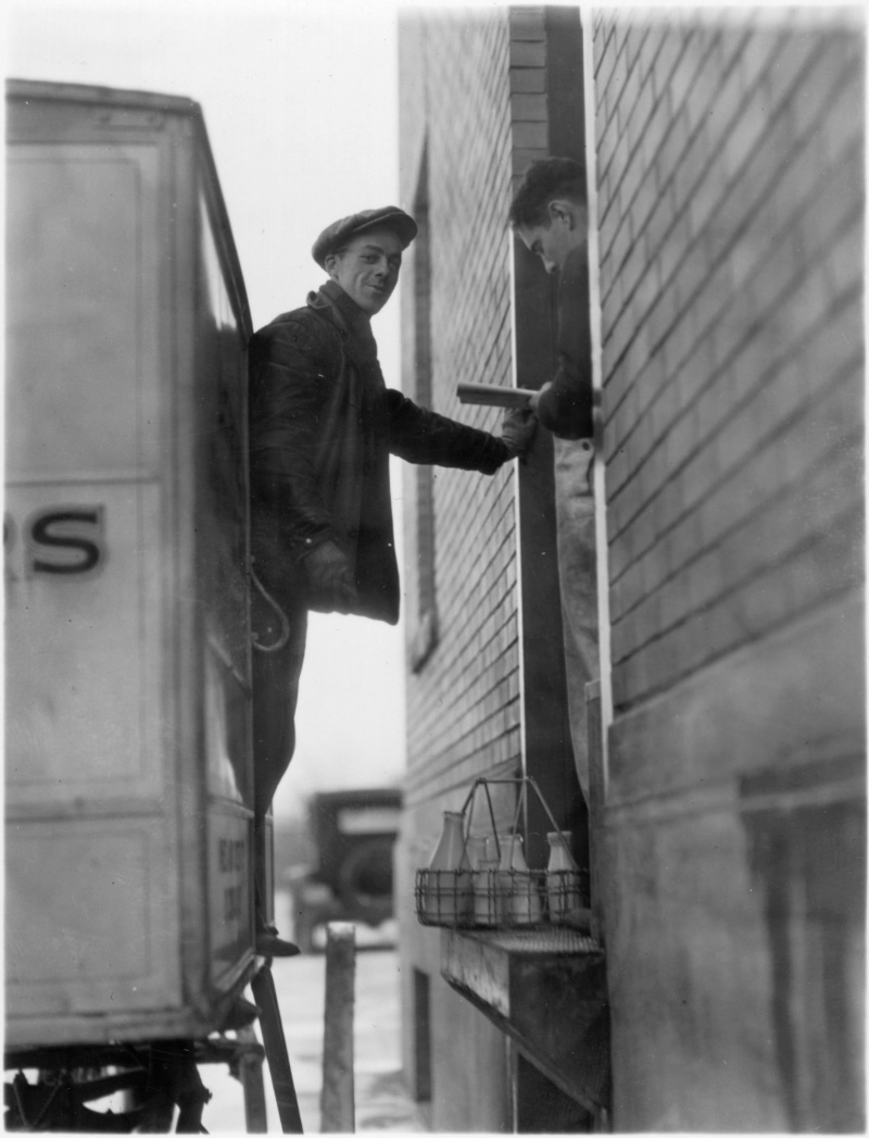 Image of a 1920s milk wagon delivery man.