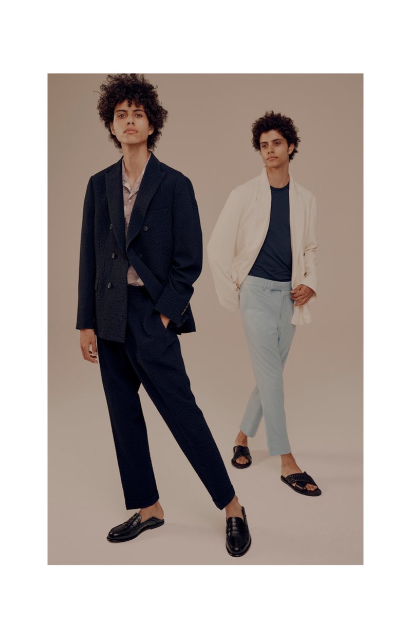 Left: Piers models an Officine Generale double-breasted seersucker blazer, shirt, and drawstring trousers with Mr P. leather penny loafers. Right: Trent wears a John Smedley t-shirt and Bottega Veneta leather sandals with a Haider Ackermann suit.