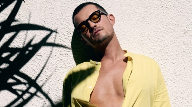 Orlando Bloom Relaxes Poolside with LOVE Magazine Orlando Bloom wears a Hermès shirt with Stella McCartney boxer shorts and Moscot sunglasses.