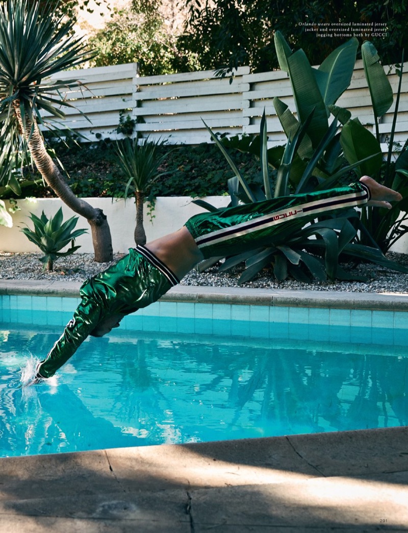 Going for a dip, Orlando Bloom sports a Gucci laminated tracksuit.