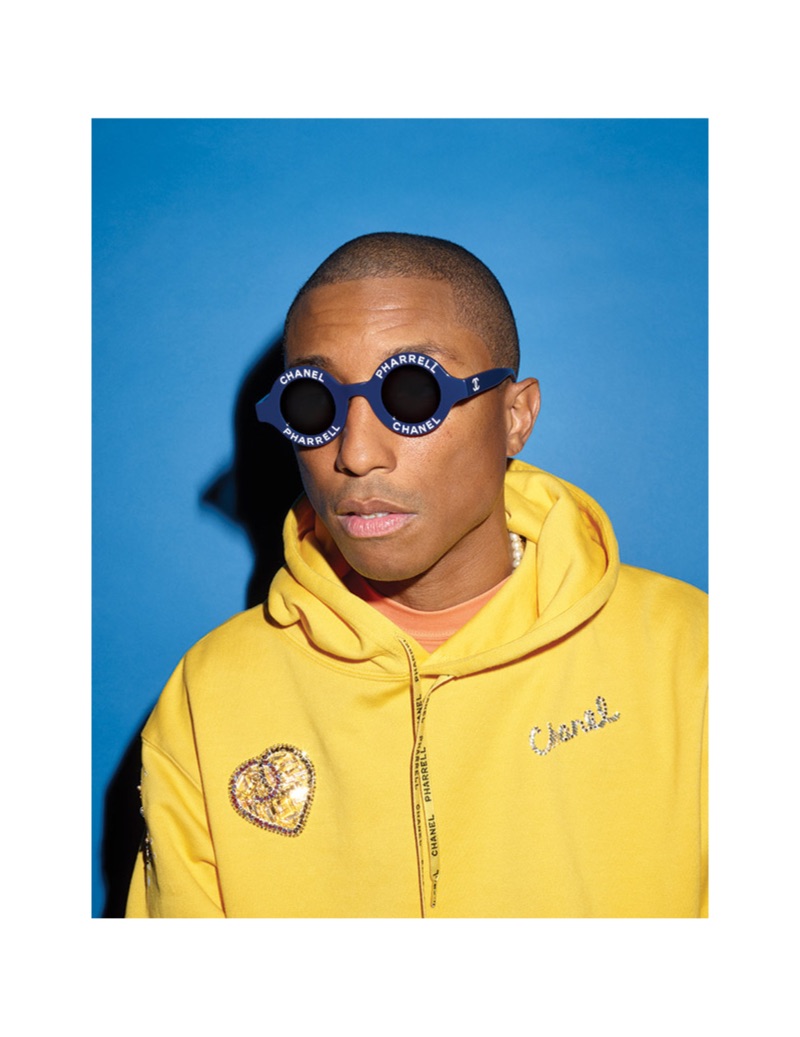Starring in a photo shoot, Pharrell rocks a yellow hoodie from the Chanel Pharrell collection.