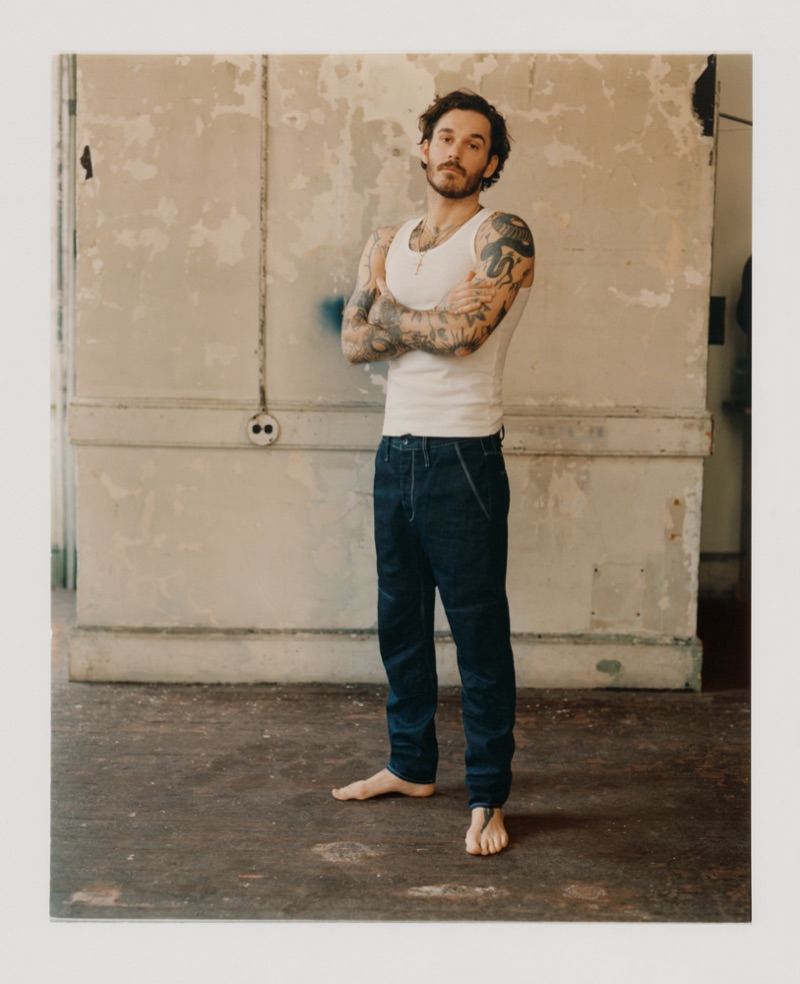 Sporting a tank, David Alexander Flinn shows off a pair of jeans from Rag & Bone.