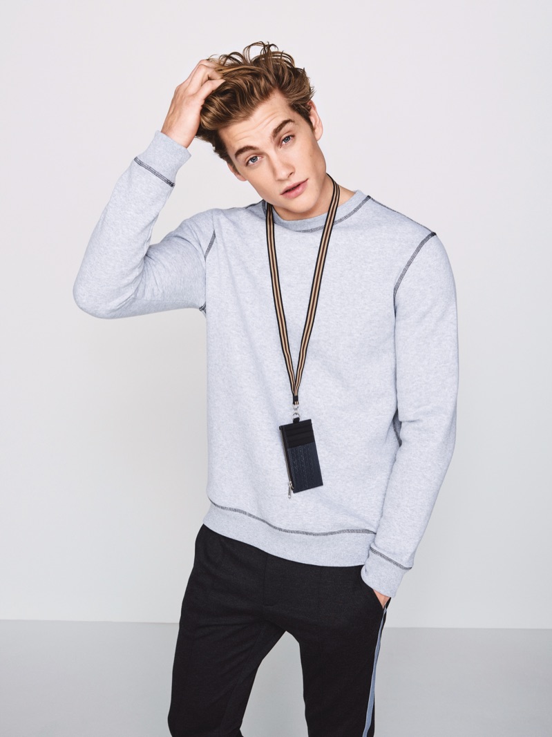 Rob Knighton goes sporty in a sweatshirt and joggers from River Island.
